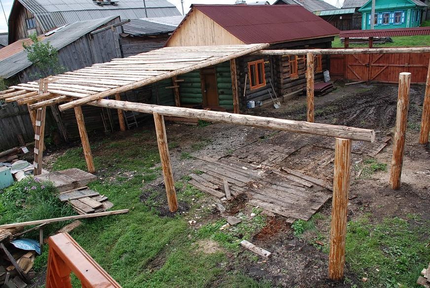 DSC_01323.JPG - Mischa starts to build our new veranda-hovel combination.